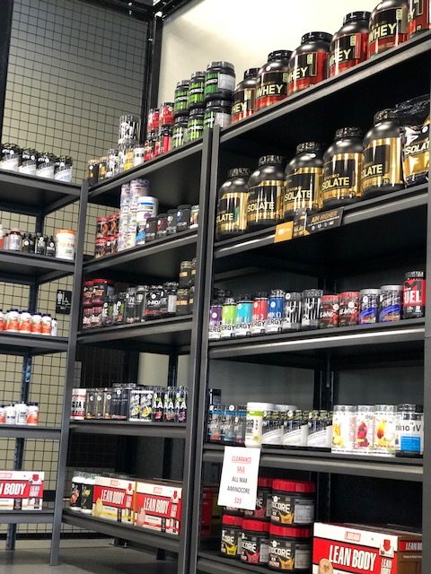 supplements on a shelf - Train Hard Fitness 8180 Oswego Rd. Liverpool, NY 13090 315-409-4764